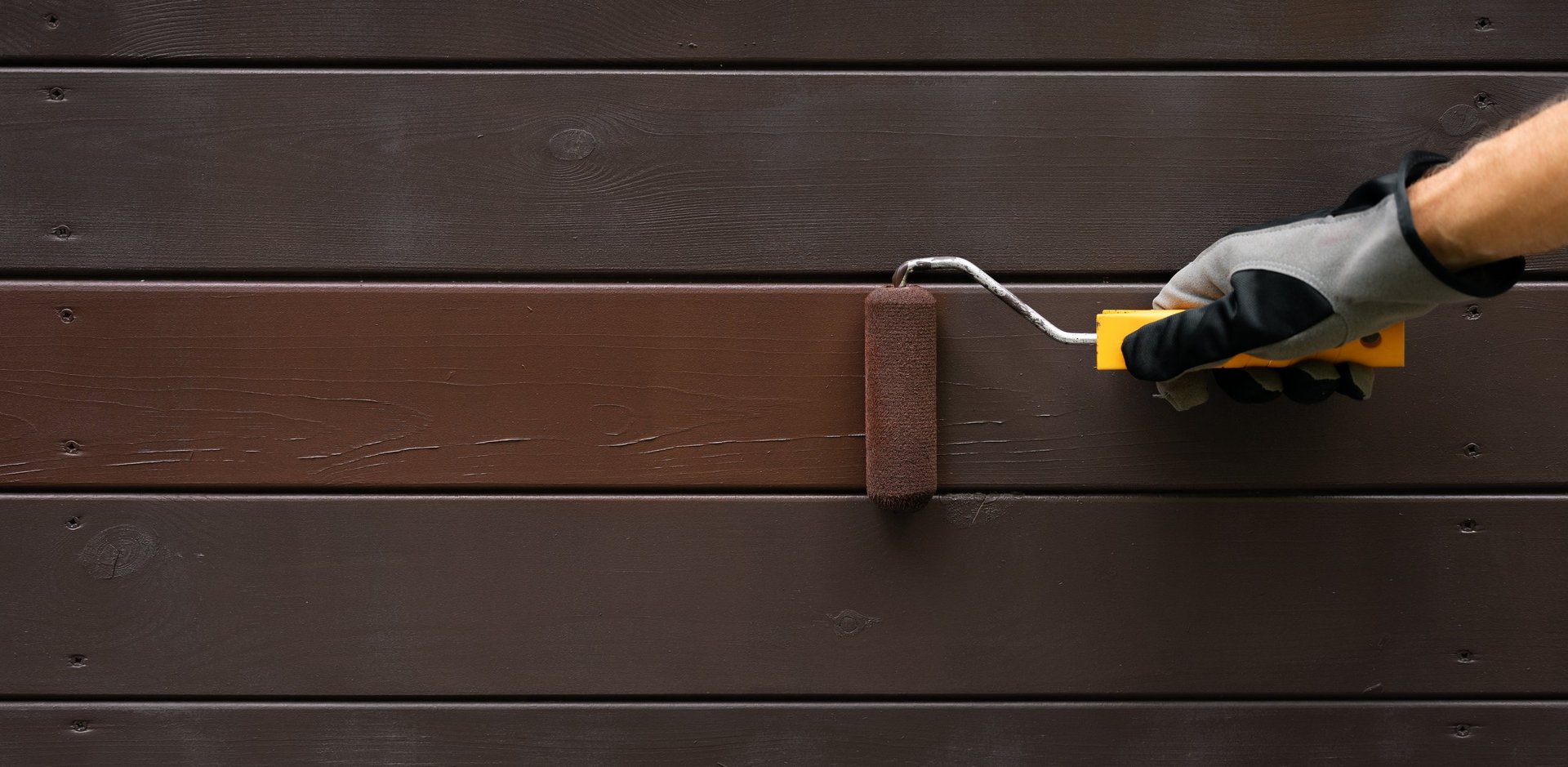 Professional painter transforming home exterior